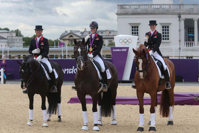 Carl Hester (left), Charlotte Dujardin (centre) and Laura Bechtolsheimer win gold