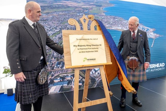 King Charles unveiling a plaque