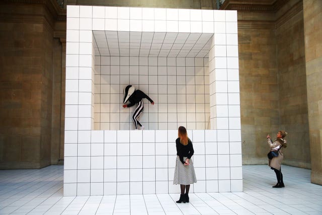 Onlookers watch Anthea Hamilton’s new work, The Squash (Yui Mok/PA)