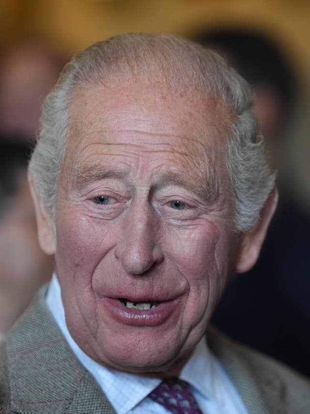 Headshot of the King smiling while speaking