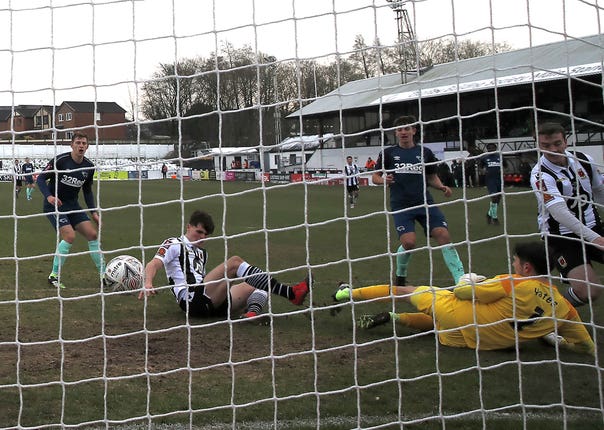 Chorley’s Mike Calveley, second left, scores his side’s second goal in their third-round win against Derby