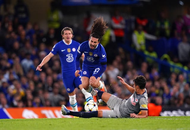 Marc Cucurella, top, is tackled by RB Salzburg’s Nicolas Capaldo