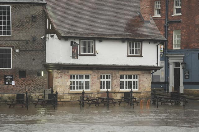 Flood water submerging the Red Lion pub