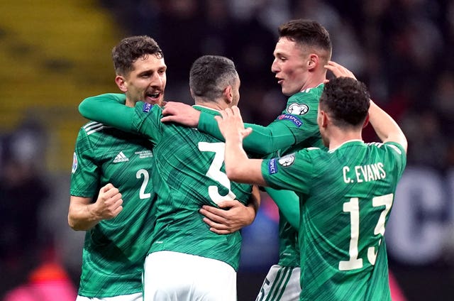 Michael Smith (centre) celebrates opening the scoring for the visitors 