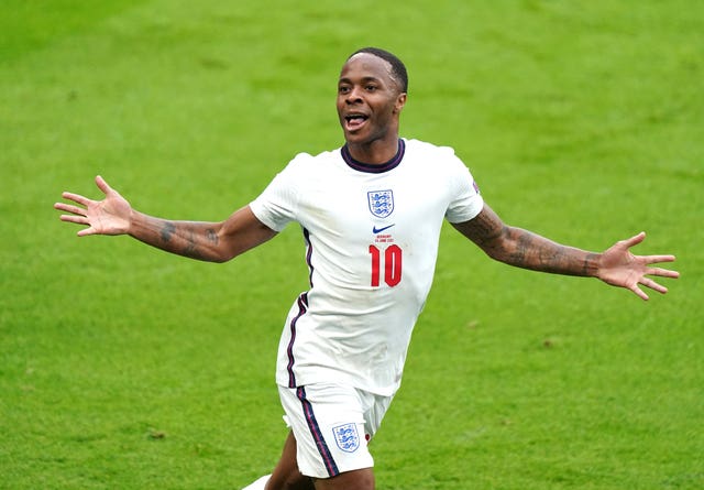 Raheem Sterling celebrates scoring the first goal of the game for England