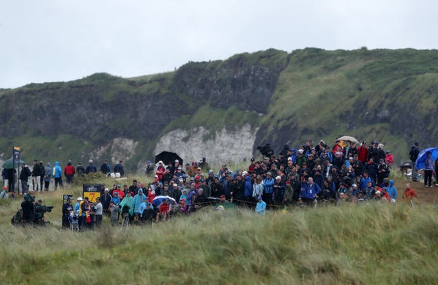 Crowds watch Northern Ireland’s Rory McIlroy on the 7th tee during day two of The Open Championship 2019 at Royal Portrush Golf Club