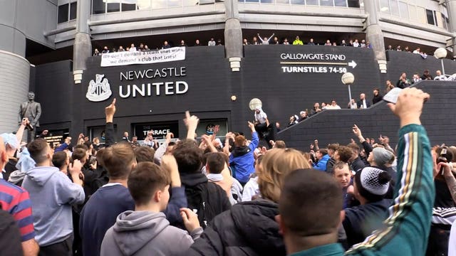 Newcastle fans celebrate confirmation of the Saudi-led takeover of the club in October 2021