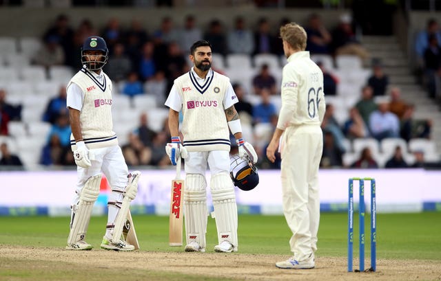 Virat Kohli, centre, and Cheteshwar Pujara, left, helped India battle back