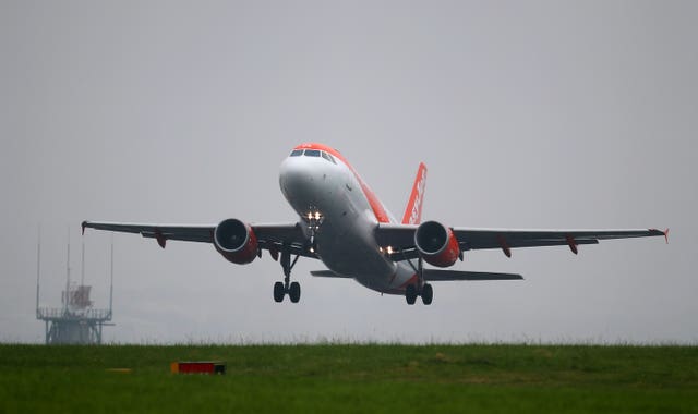 An Easyjet plane taking off (Peter Byrne/PA)