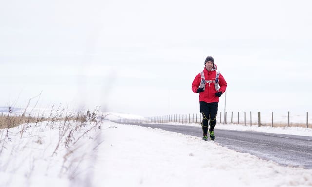 Runner Matt Oldham braves the weather