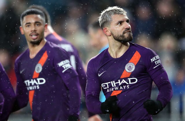 Manchester City kept alive hopes of a quadruple with late victory in the FA Cup at Swansea