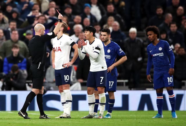 Anthony Taylor shows Son Heung-min a red card for kicking Antonio Rudiger in a separate incident 