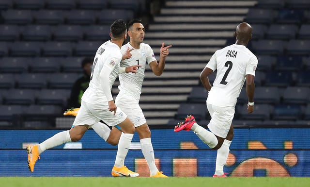 Israel’s Eran Zahavi (centre) celebrates scoring