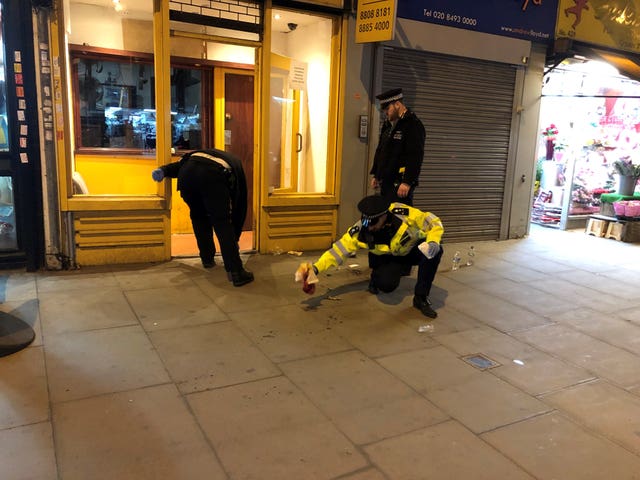 Police activity at a cordoned off area in High Road, Tottenham