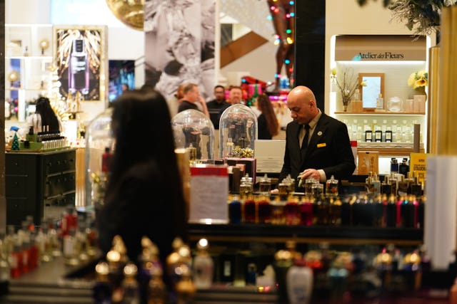 A member of staff at Selfridges prepares for the store's Boxing Day sale