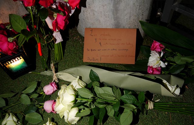 Flowers and teddy bears left at the children’s play area