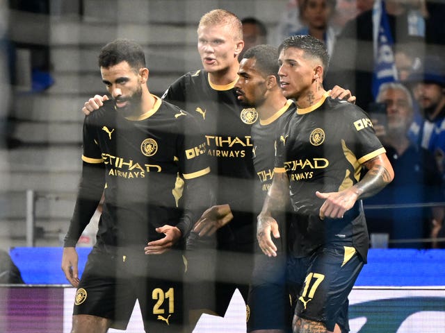 Manchester City’s Erling Haaland, centre left, celebrates his second goal against Porto