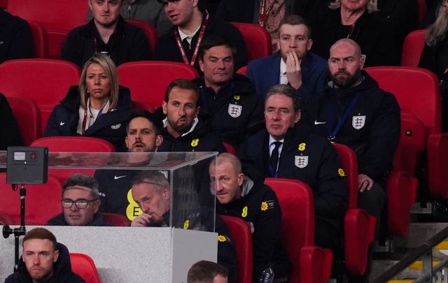 England captain Harry Kane, centre, in the seats behind the team bench at Wembley
