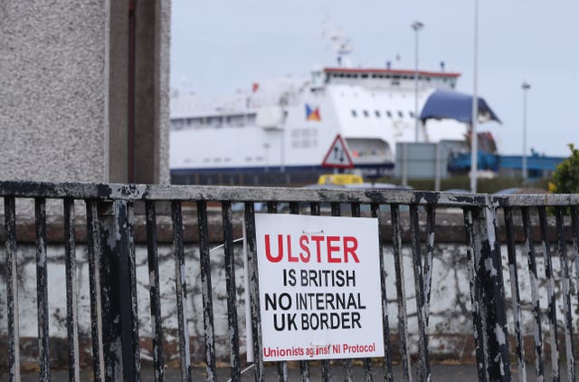 A sign protesting against the Northern Ireland Protocol in Larne Harbour