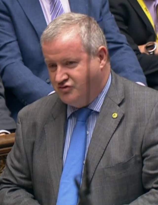 Theresa May was challenged over Donald Trump's immigration policy by SNP Westminster leader Ian Blackford at PMQs (PA Wire/PA Images)