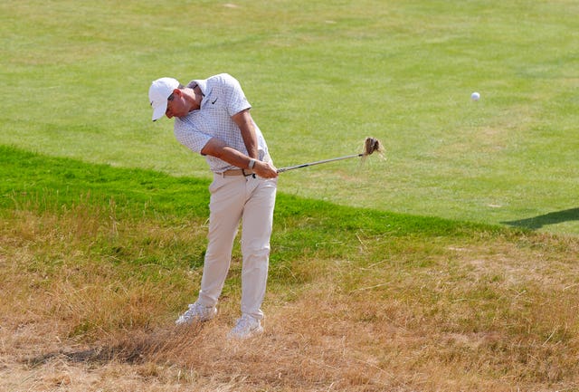 Rory McIlroy plays from the rough