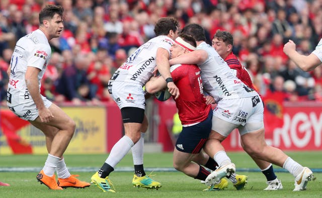 Danny Cipriani, second left, tackles Rory Scannell, centre, on Saturday