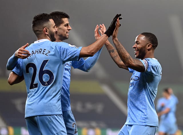 Goalscorers Riyad Mahrez, left, and Raheem Sterling, right, celebrate