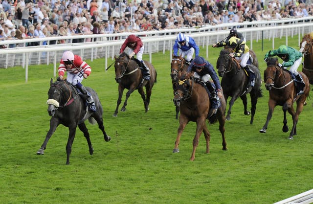 Irad Ortiz (navy blue) finishing second on Acapulco in the Nunthorpe at York