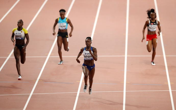 Dina Asher-Smith (centre) powered through to the final