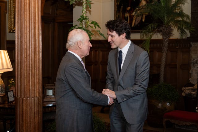 Canadian Prime Minister Justin Trudeau shakes hands with the King at Sandringham