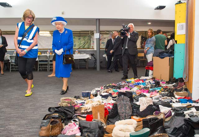 The Queen visited the Westway Centre to see the donations (Dominic Lipinski/PA)