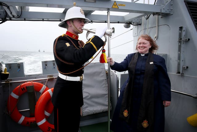Royal Marines bugler Steven Booth and Reverend Dr Karen Campbell on board HMS Raider (Jane Barlow/PA)