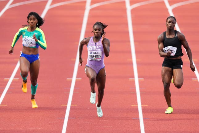 Dina Asher-Smith, centre, was the fastest qualifier for the women's 100m semi-finals at the World Championships in Oregon