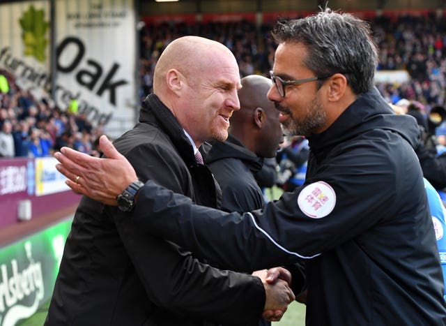 Burnley manager Sean Dyche (left) greets Huddersfield counterpart David Wagner 