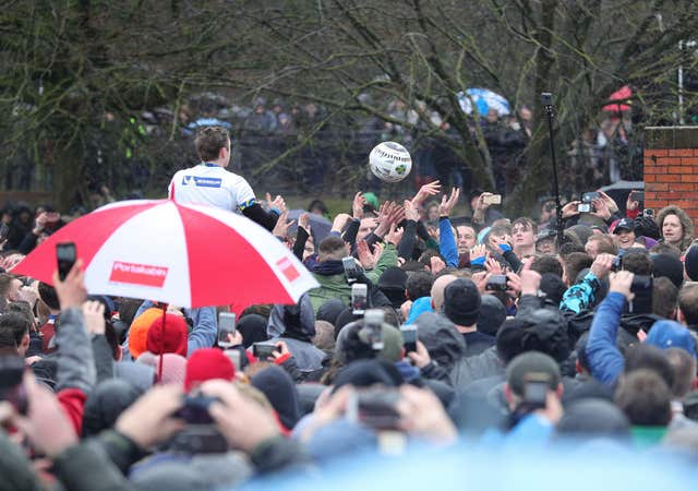 There is always one person blocking your view with an umbrella at theses things (Aaron Chown/PA)