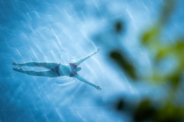 A person swimming in the sky pool in Nine Elms