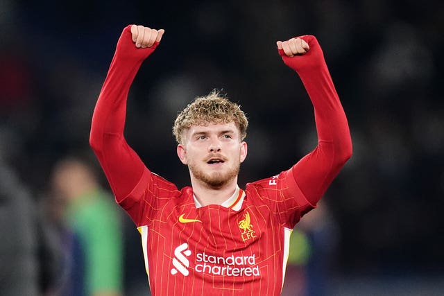 Liverpool’s Harvey Elliott raises his arms to celebrate a win