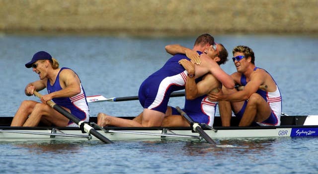 Tim Foster, Matthew Pinsent, Steve Redgrave, and James Cracknell celebrate after winning gold in Sydney