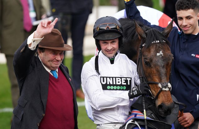 Nico de Boinville and Nicky Henderson celebrate winning the Supreme Novices’ Hurdle with Constitution Hill