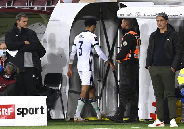 Northern Ireland’s Jamal Lewis leaves the pitch after receiving a red card