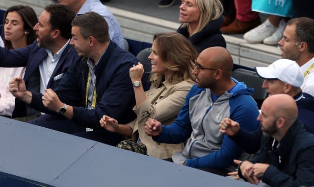 Andy Murray’s wife Kim, centre, celebrates after he and Feliciano Lopez won a point