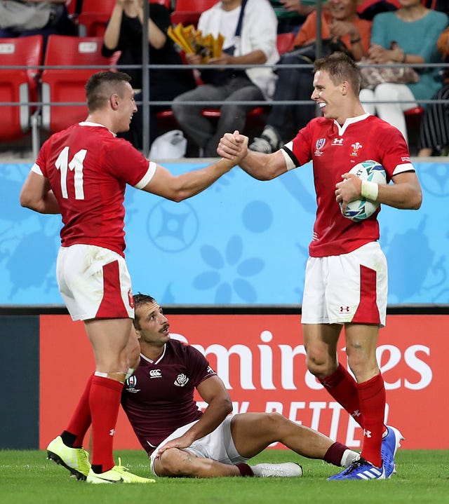 Liam Williams, right, celebrates his bonus-point try