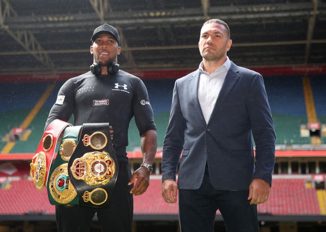 Anthony Joshua, left, defends his WBA, WBF and WBO heavyweight titles against Kubrat Pulev next month (Nick Potts/PA)