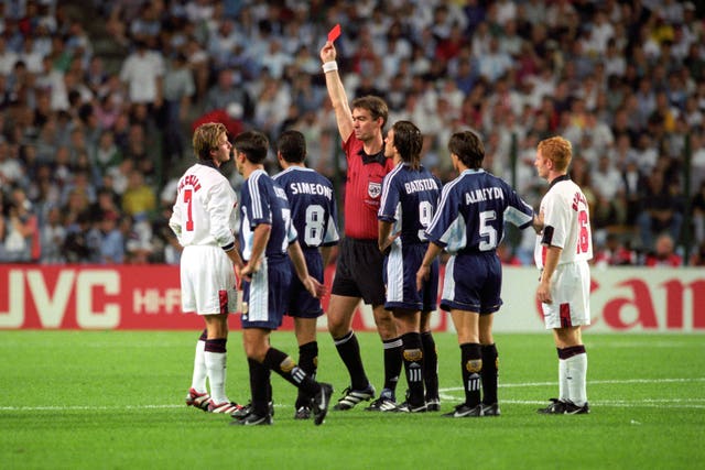 David Beckham is shown the red card by referee Kim Milton Nielsen following a foul on Argentina’s Diego Simeone during their France '98 World Cup second round match in St Etienne.