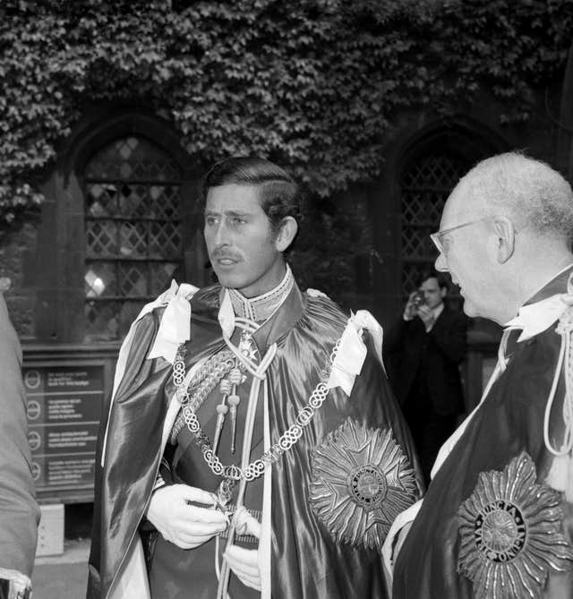 The then-Prince of Wales, sporting a moustache, in Westminster Abbey after the Queen installed him as Great Master of the Order of the Bath in 1975
