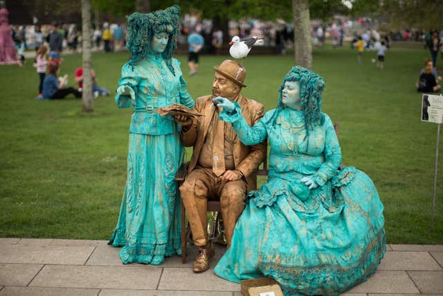 Performers The Goldman (centre) and Bubble Fairies get to know eachother (Aaron Chown/PA)