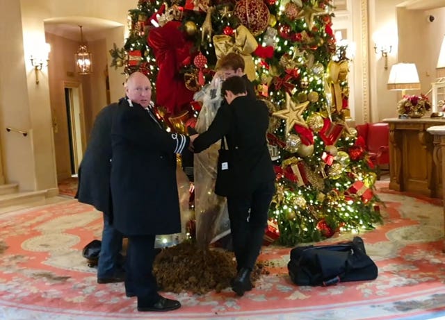 A screengrab taken from a video issued by Take Back Power of protesters dumping horse manure beside the Ritz Hotel’s Christmas tree