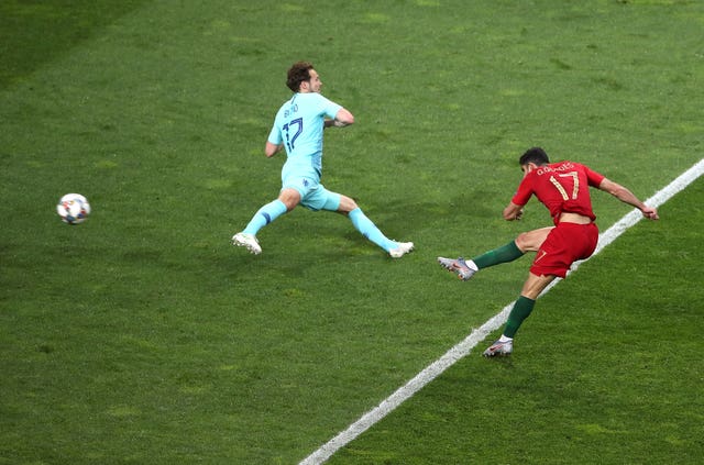 Goncalo Guedes, right, fires Portugal's winner in the Nations League final