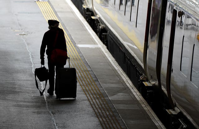 A passenger walks along a platform at Waverley Station in Edinburgh