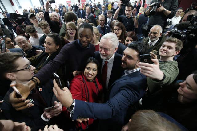 Labour leader Jeremy Corbyn poses for selfies with supporters after he delivered his major speech on Brexit. (Aaron Chown/PA)
